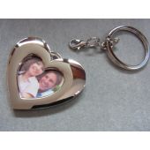 Verzilverde sleutelhanger met ruimte voor foto en gravure.